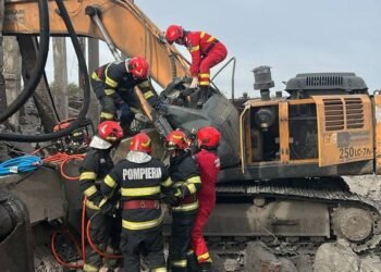 Muncitor strivit sub a grindă de beton